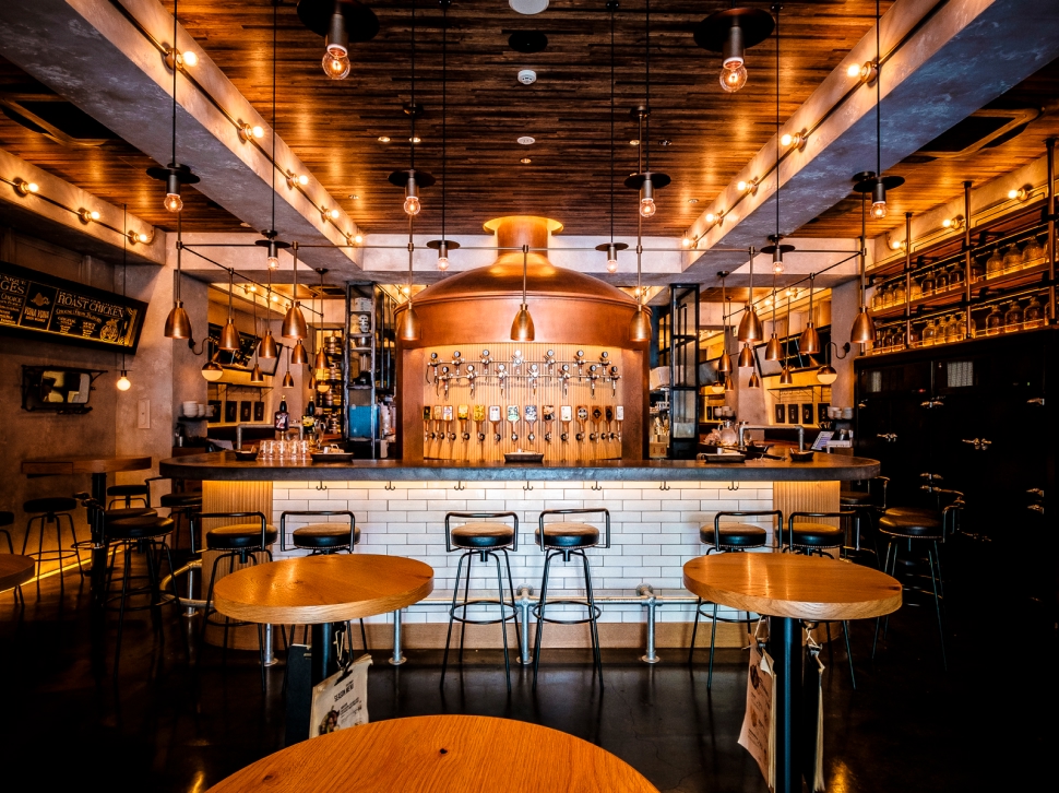 Bar counter with many taps at YONA YONA BEER WORKS Ebisu East Exit Branch