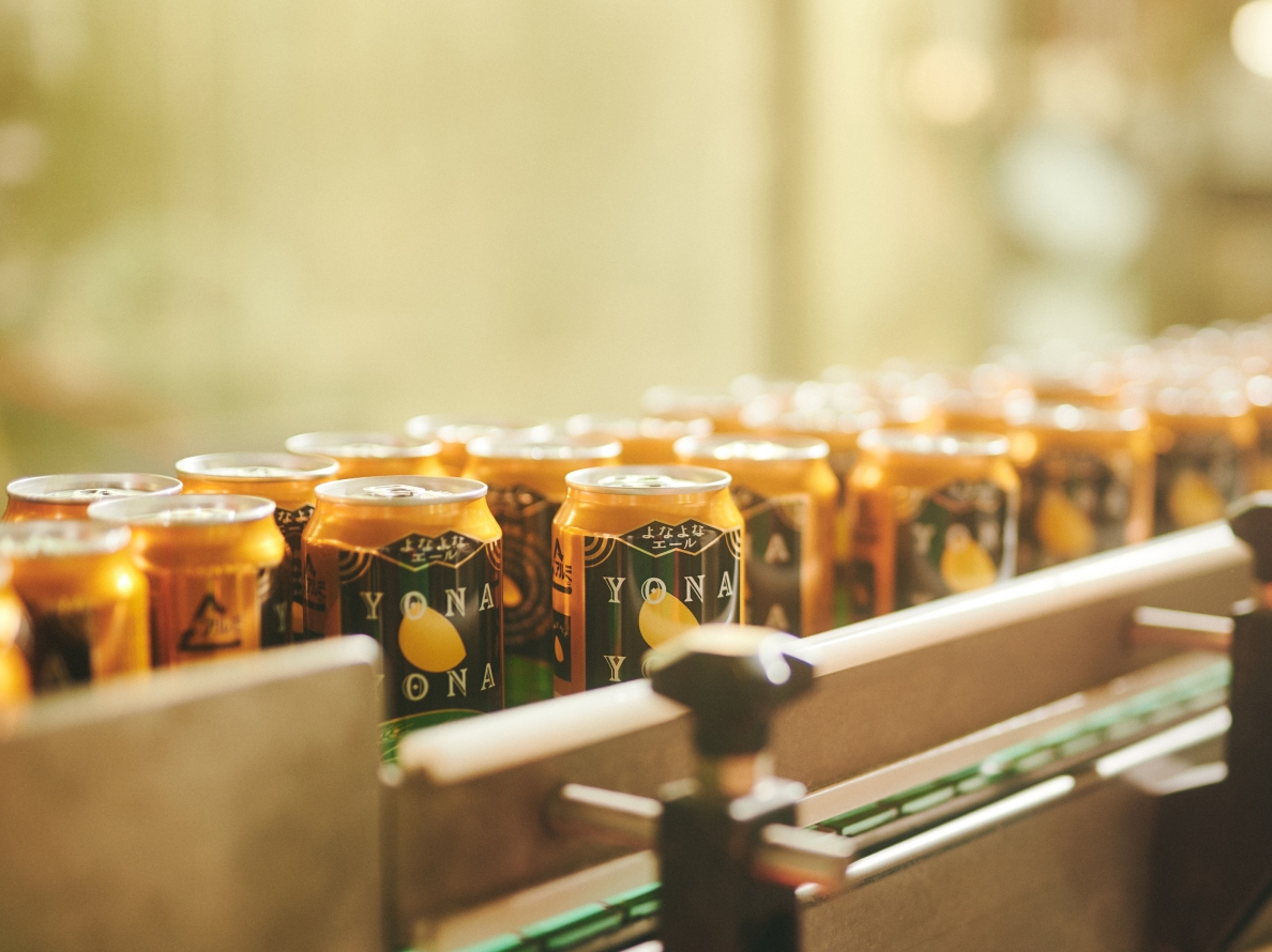 Filled cans of YONA YONA ALE at Saku Brewery