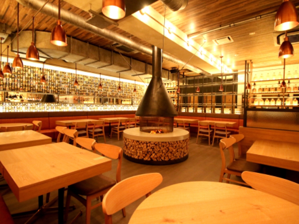 Interior with beer cans covering the entire wall at YONA YONA BEER WORKS Shinjuku East Exit Branch